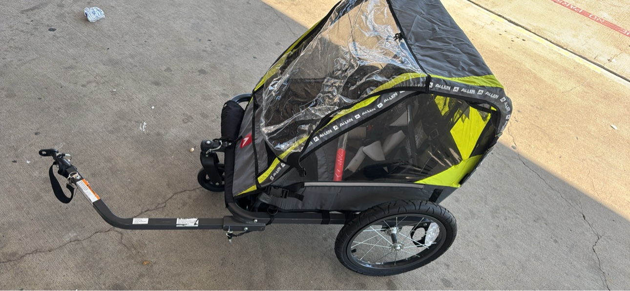 Side view of the Allen Sports trailer with tow arm and rain cover