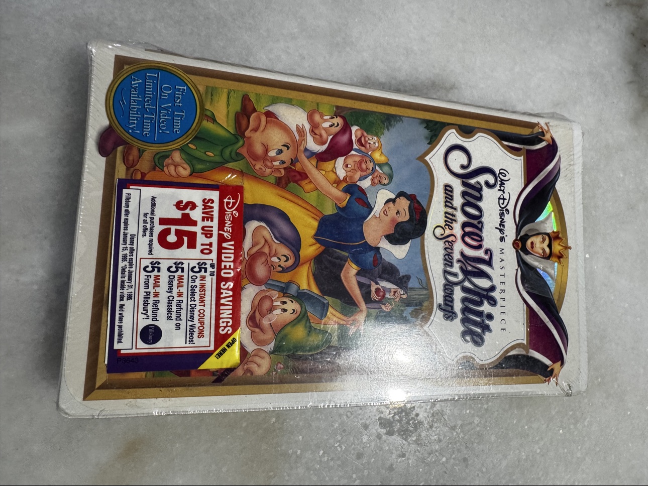 Front cover of sealed Snow White and the Seven Dwarfs VHS with Disney Video Savings sticker