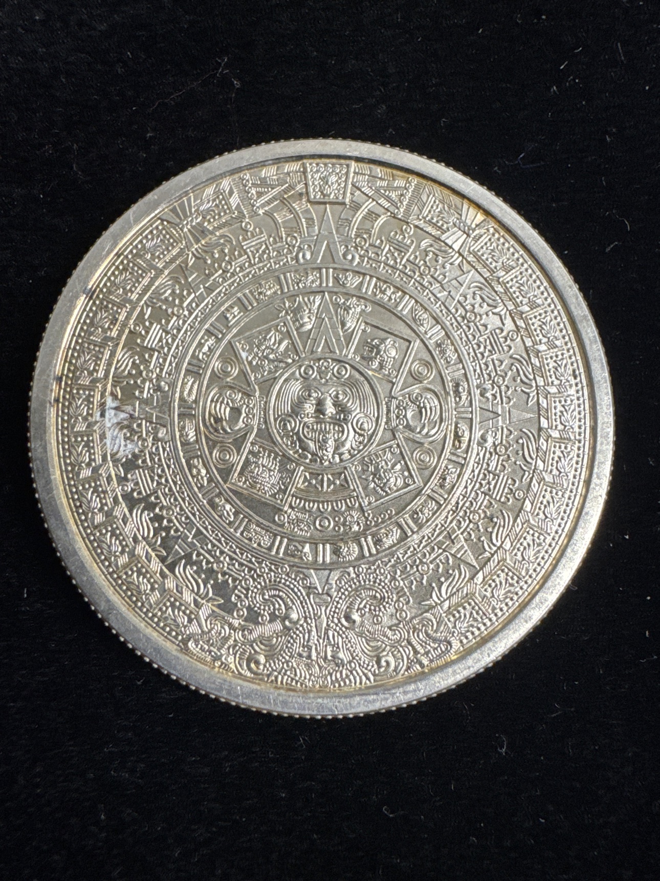 Aztec calendar stone side of the one-ounce .999 fine silver round