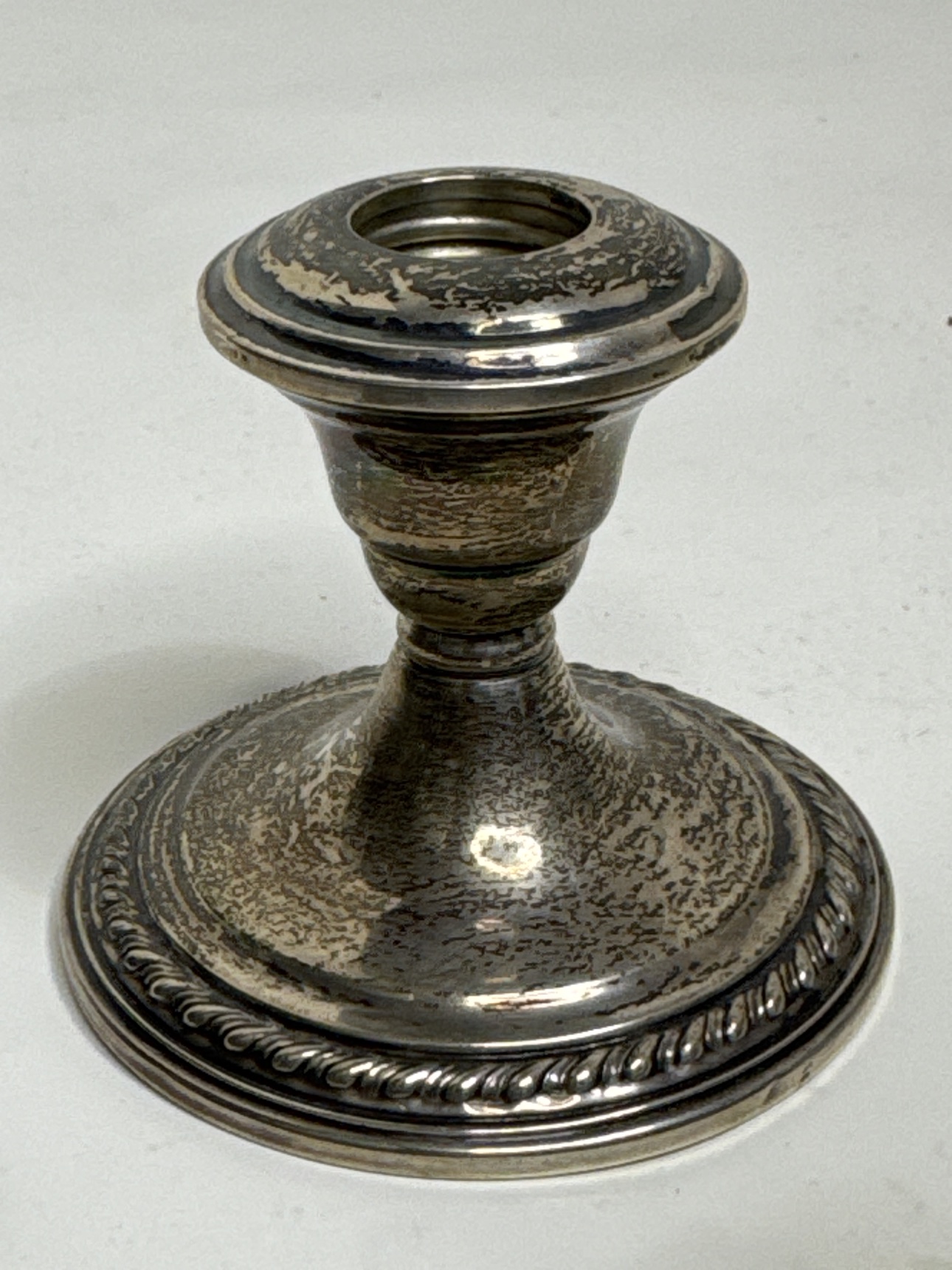 Full La Pierre sterling silver candlestick on a white background