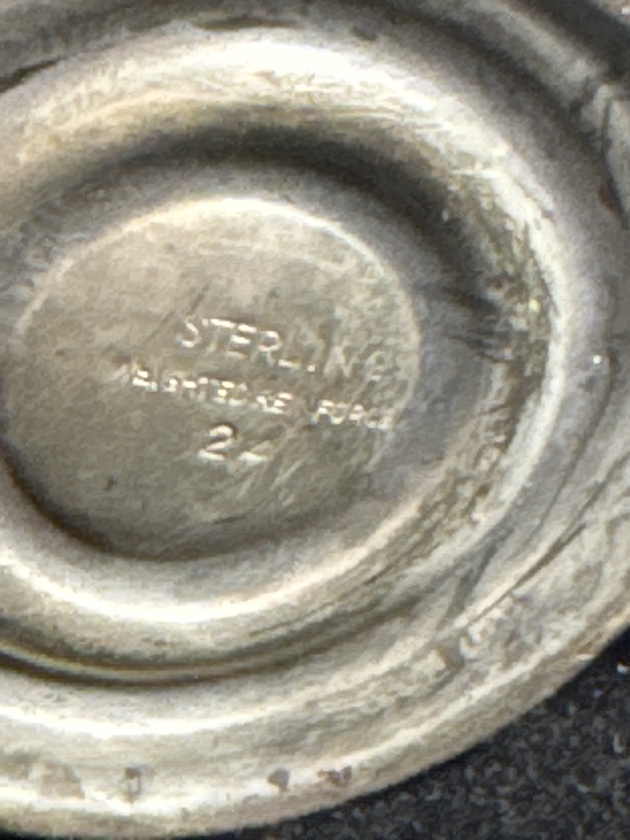 Close-up of the Sterling Weighted Reinforced mark on the shaker base